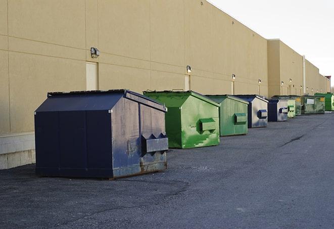 large garbage containers clustered on a construction lot in Spring Grove